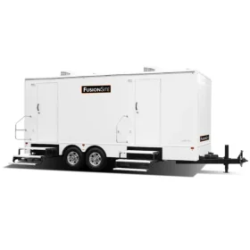 A large FusionSite luxury restroom trailer with six to ten private stalls, dual axles, and wide entry steps for high-capacity events.