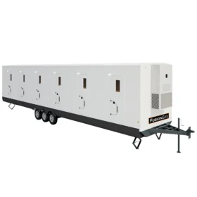 A large white FusionSite bunkhouse trailer with multiple entry doors and triple axles, designed for temporary housing and workforce accommodations.