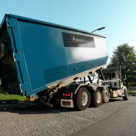 dumpster roll off rental preparing for a construction site drop off