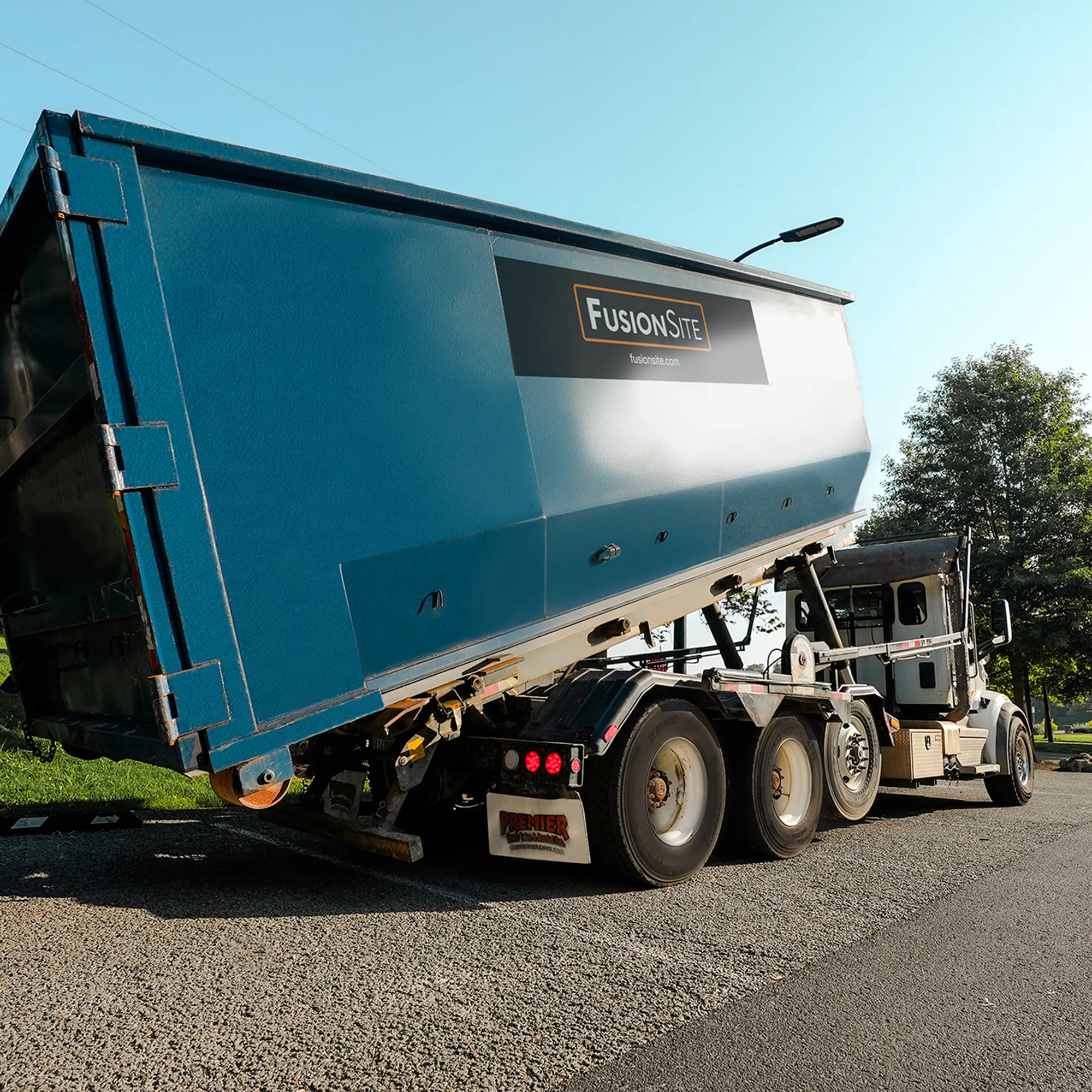 dumpster roll off rental preparing for a construction site drop off