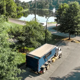 roll off dumpster rental in navy with fusionsite logo aerial shot